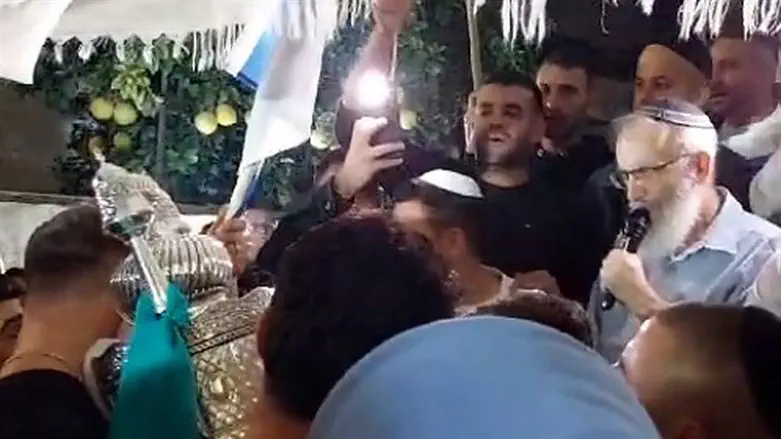 Dedicating a Torah scroll at the home of hostage Mia Shem