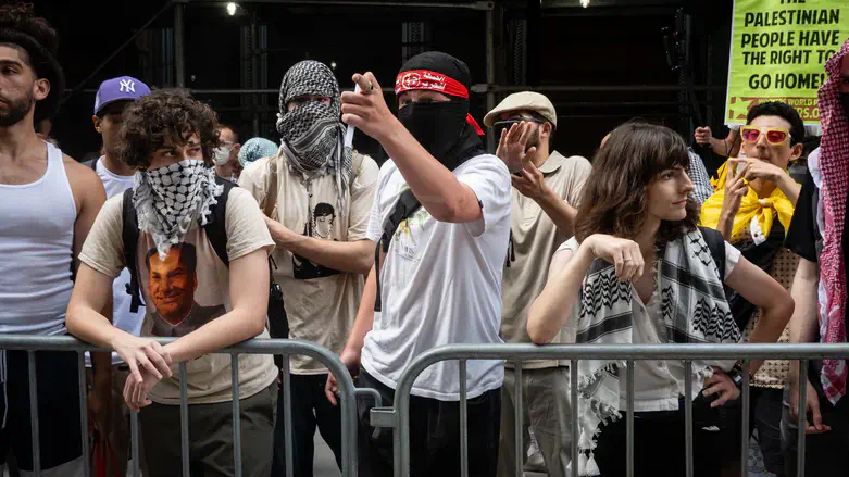 A protester wearing the headband of the PFLP terror group at Baruch College in NYC