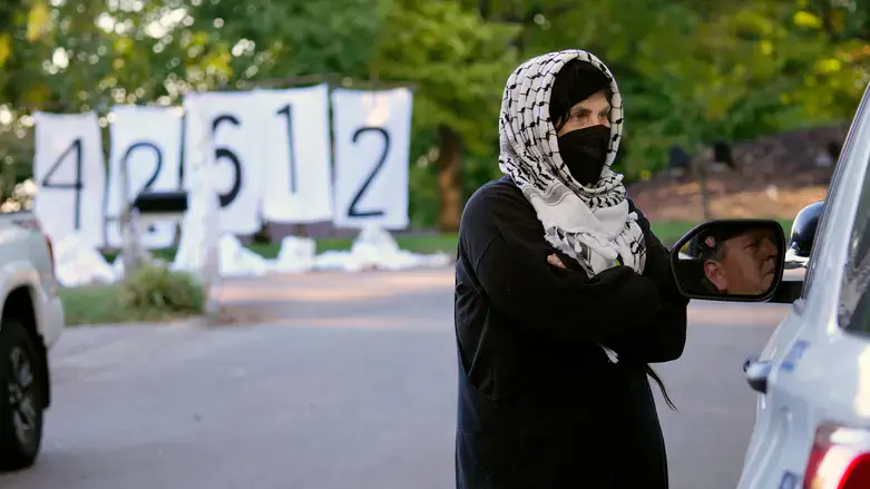 Masked protester at home of Greg Landsman