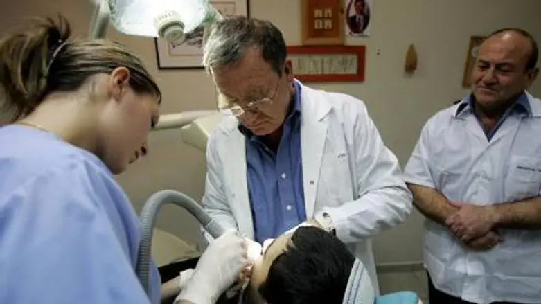 Dentists treat child