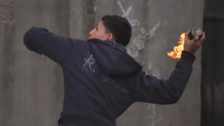 Arab youth throws firebomb