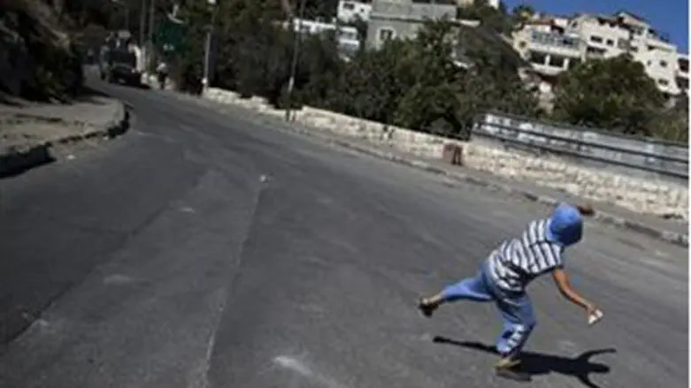 Jerusalem Arab boy throws stone