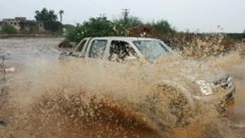 Car plows through rare heavy rain in Eilat