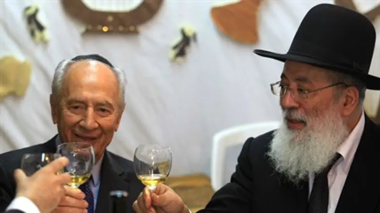 President Shimon Peres in his sukkah