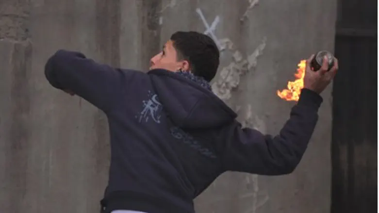 Arab youth throws firebomb