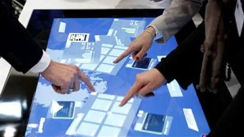 Touch screens at booth of Microsoft at comput