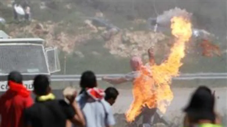 PA Arab throws firebomb at Israeli forces.