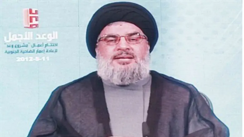 Nasrallah addresses supporters via a screen