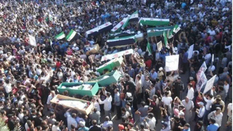 Syrians carry bodies of people protesters sai