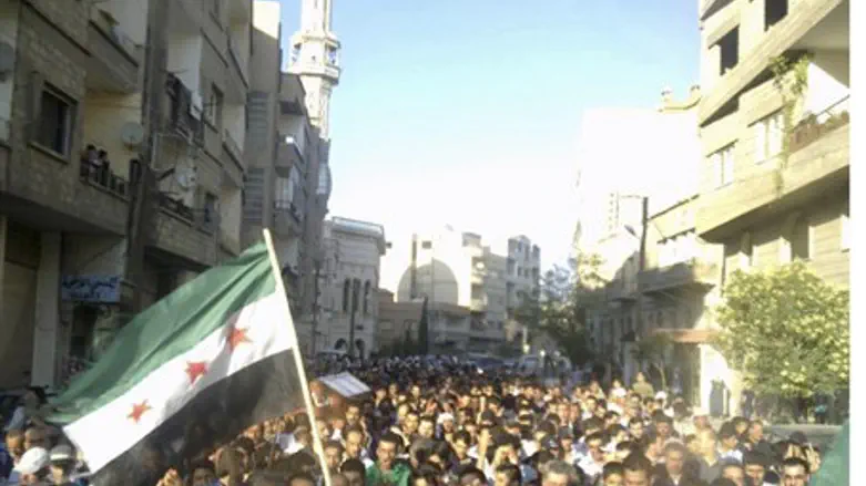 Opposition funeral in Damascus for boy killed