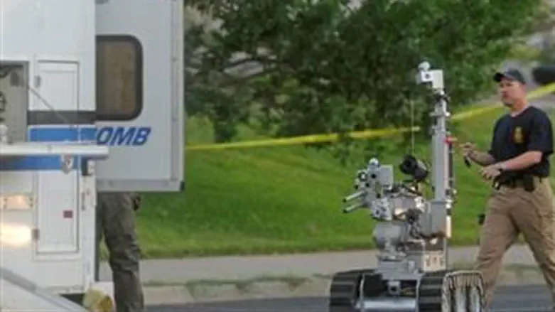 Aurora bomb squad robot searches a suspect's 