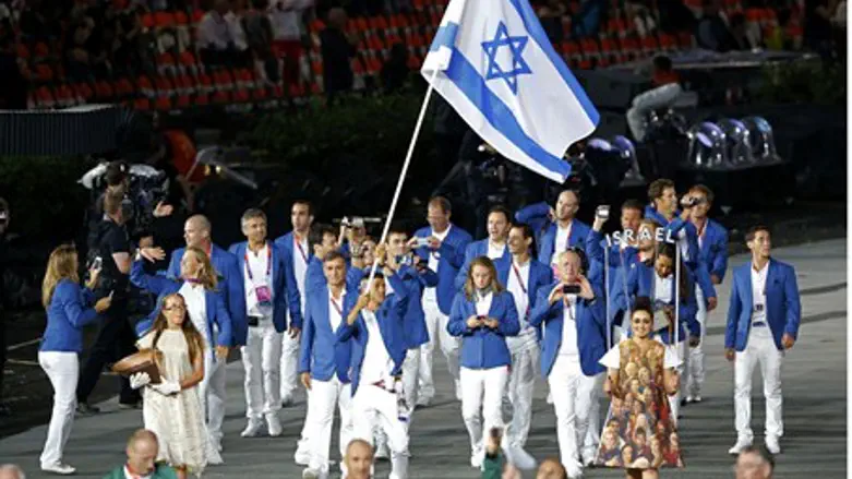 Israel's flag bearer Shahar Zubari holds the 