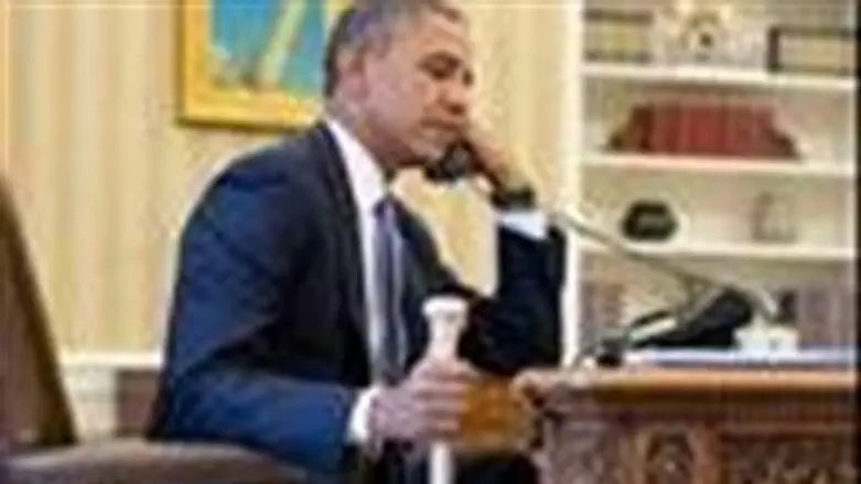 Obama holding baseball bat while talking with