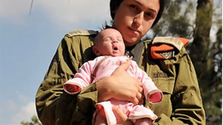 Combat officer Shukrun and her baby girl