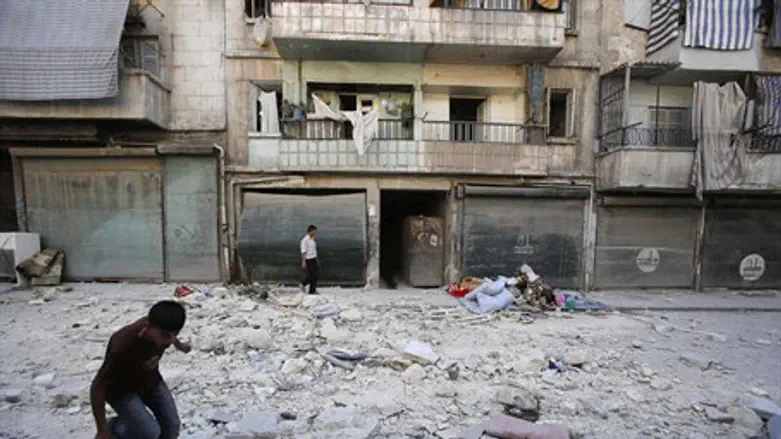 Civilians outside their Aleppo home