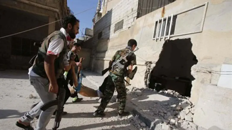 Syria rebels evacuate body.