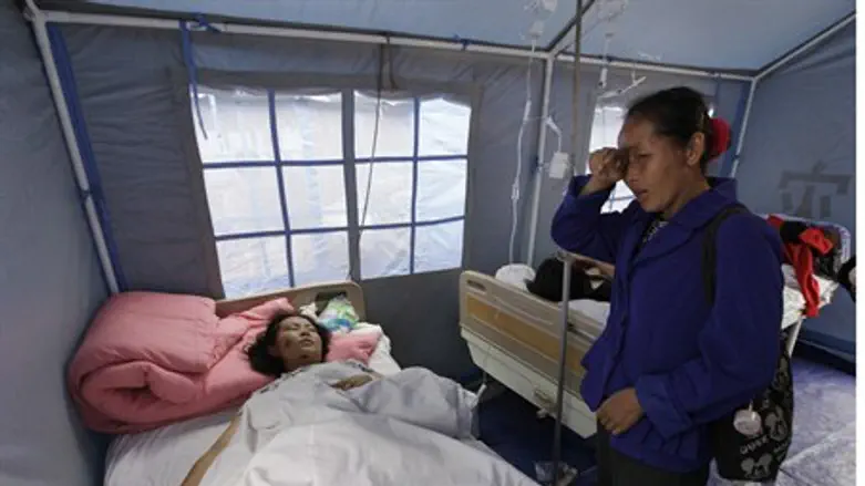 Daughter cries over mother who survived China