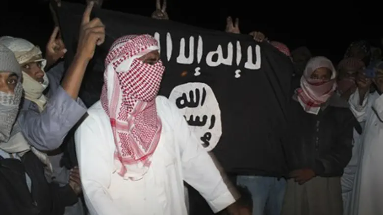 protesters carry an al Qaeda flag that reads: