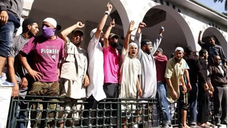 Tunisian Salafists shout slogans outside the 