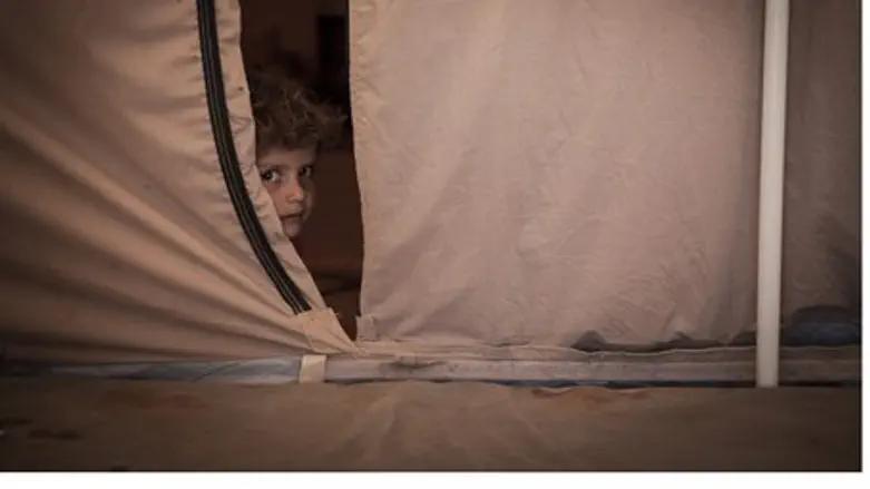 Syrian child, age 5, at refugee camp in Jorda