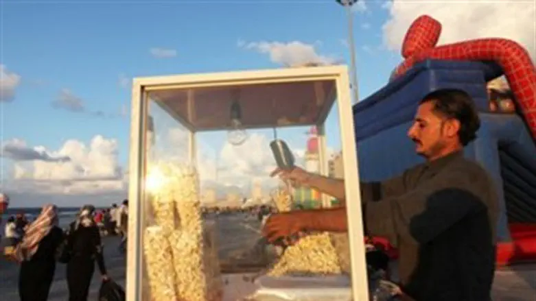 A man sells popcorn by the beach in Benghazi 