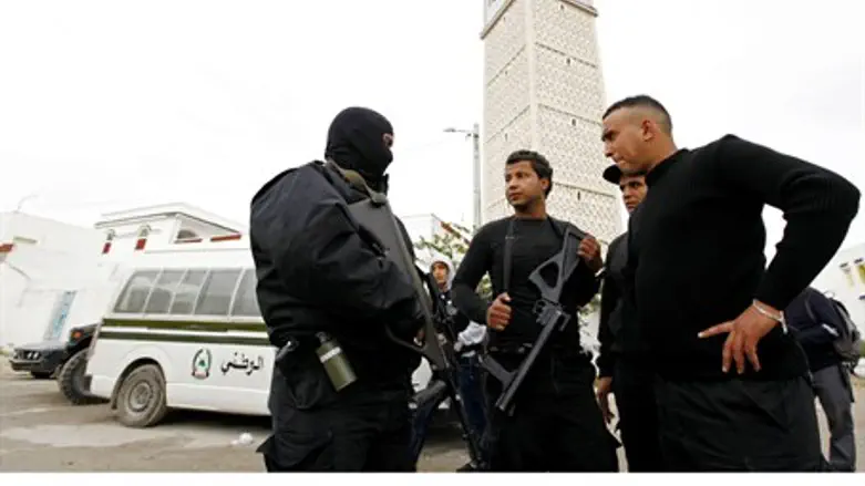 Tunisian police on guard outside mosque in Tu