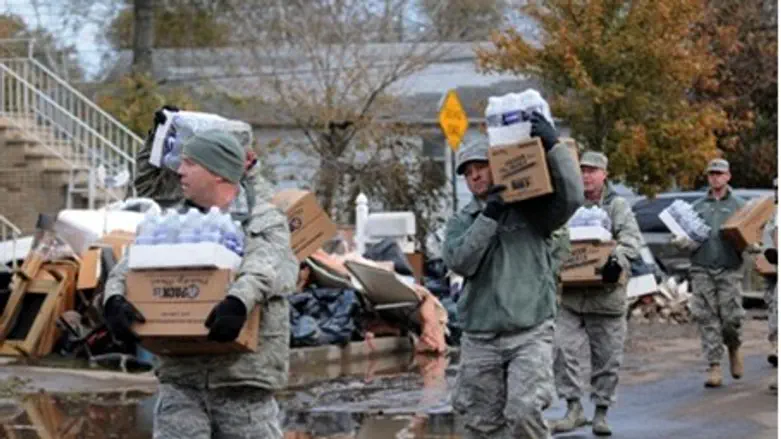 New York Army Guard takes water and food to r