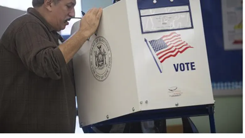 Poll worker helps voter in Staten Island, NY 