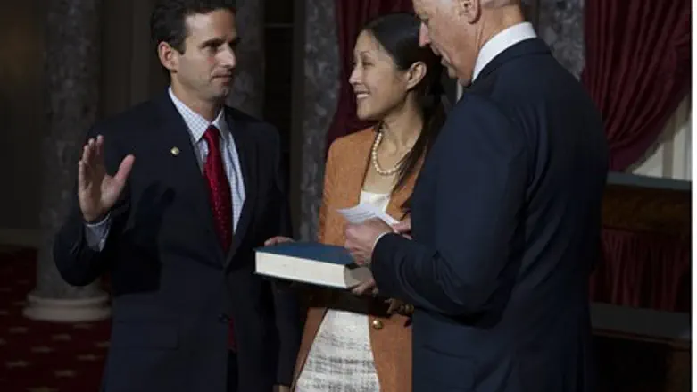 U.S. Senator Schatz stands with his wife whil
