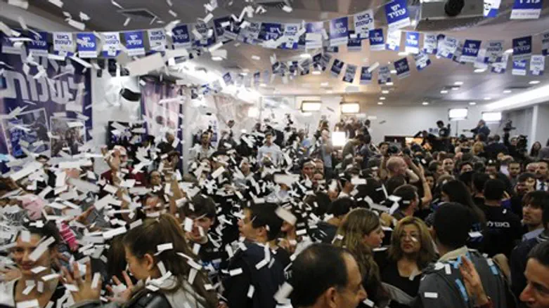 Supporters of Yesh Atid celebrate at the part