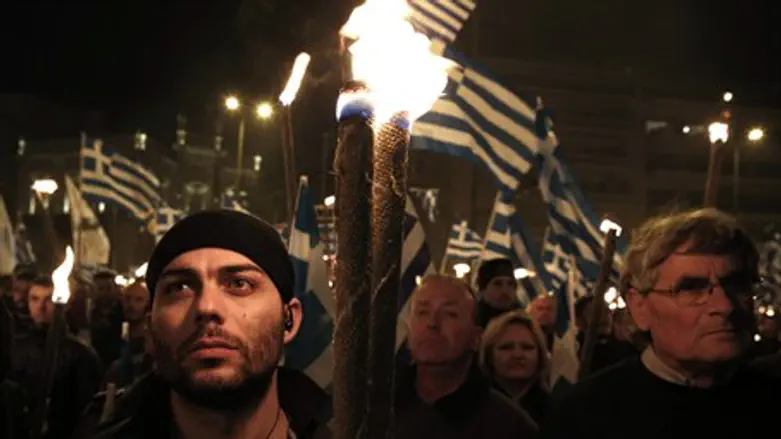 Golden Dawn supporters march through Athens