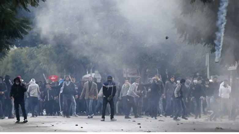 Protesters clash with riot police near the In