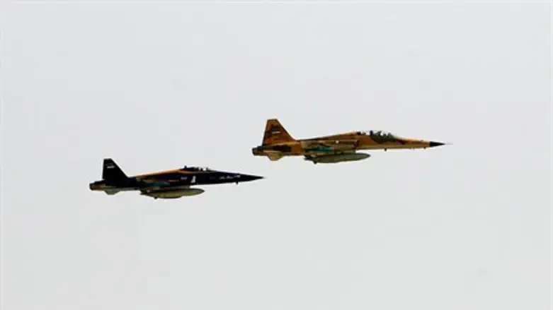 Iranian-made jets fly over the sea off the co
