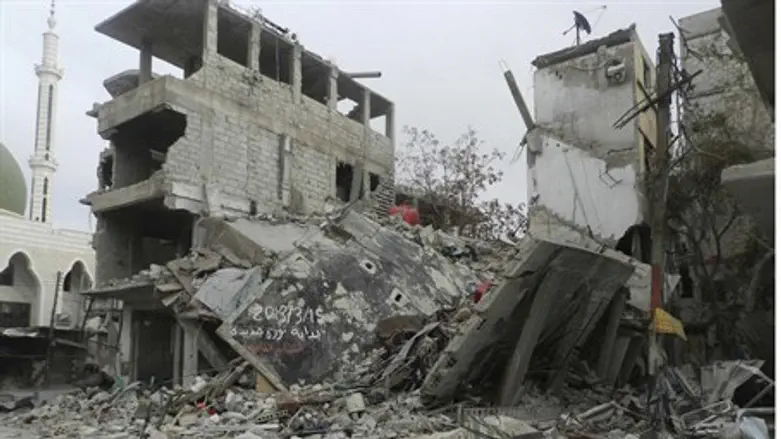 Damaged buildings after shelling near Damascu