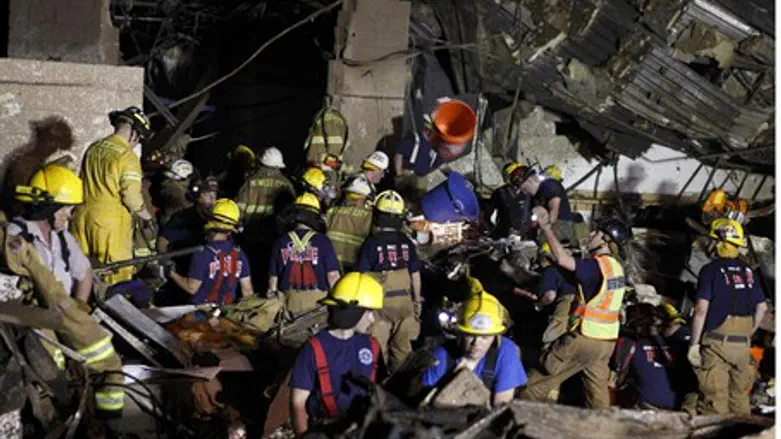 rescue workers dig through rubble after Oklah