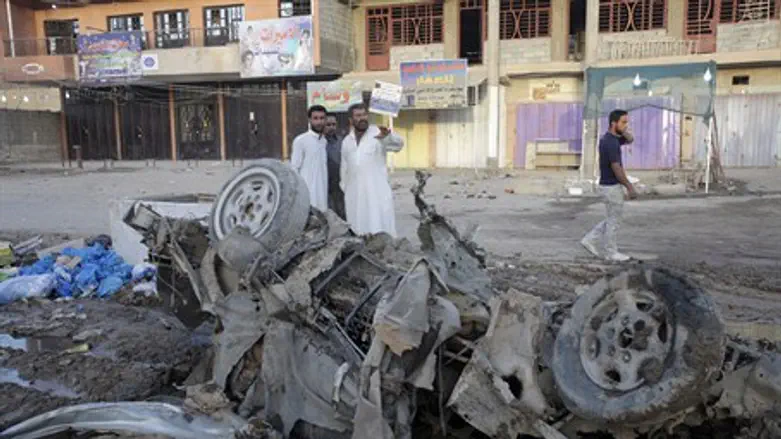 Aftermath of car bomb in Baghdad, August 2013