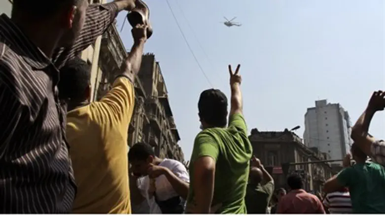 Egyptians gesturing at helicopter