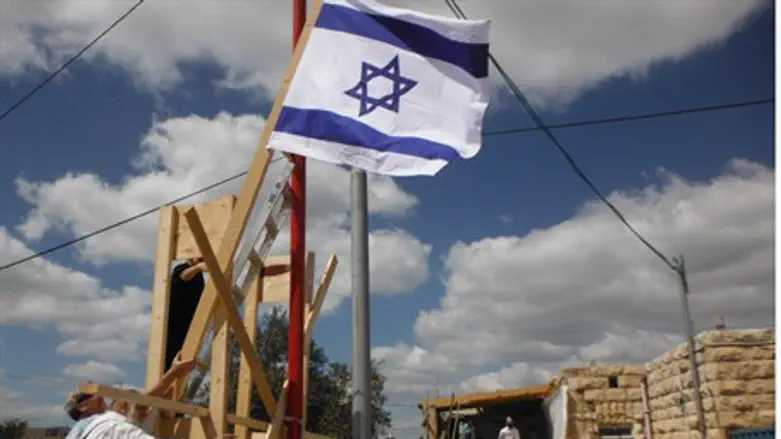 Raising the flag over Beit Safafa.