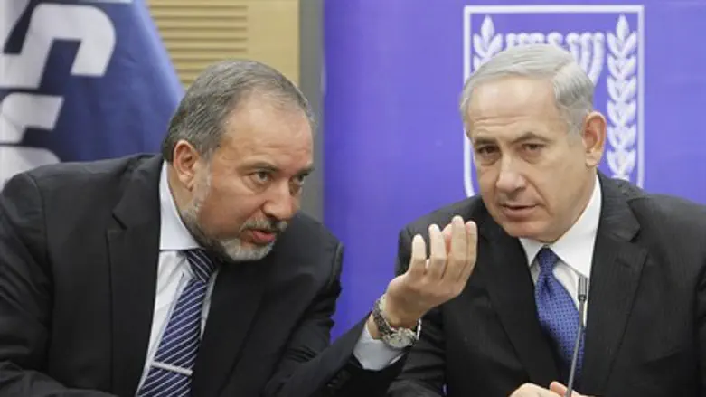 Liberman and Netanyahu at a faction meeting earlier this year