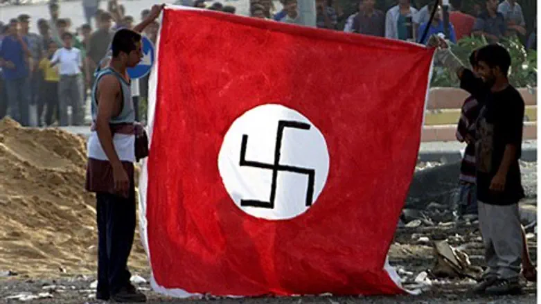 Palestinian Arabs hold Nazi flag (file)