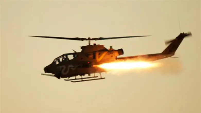 Illustration: IDF helicopter firing missile