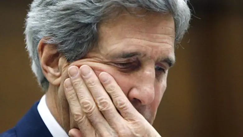 John Kerry waits to testify before committee 