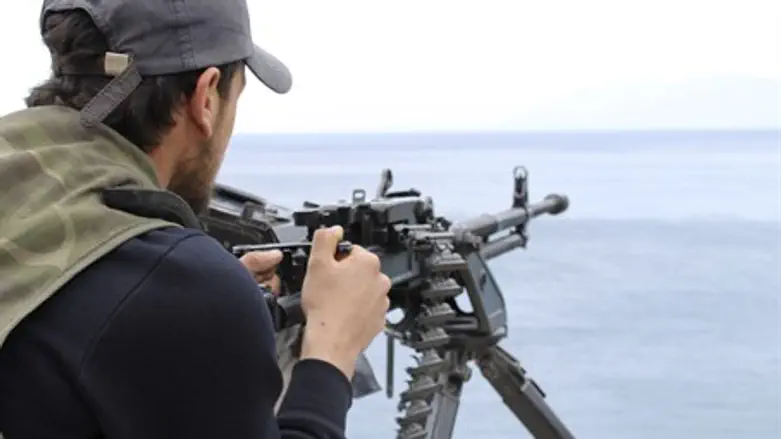 Syrian rebel on the lookout for regime gunboa