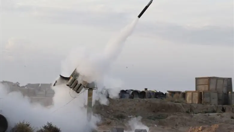 Illustration: Rebels fire a rocket near Raqqa