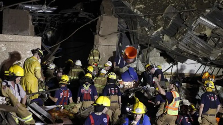 rescue workers dig through rubble after Oklah