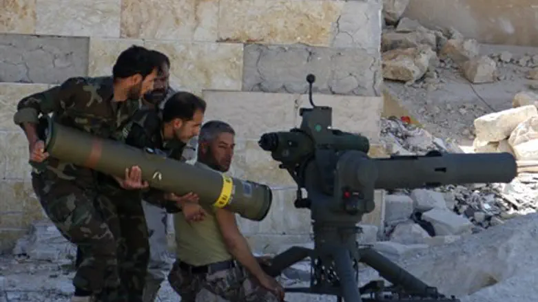Syrian rebels prepare to launch an anti-tank missile (file)