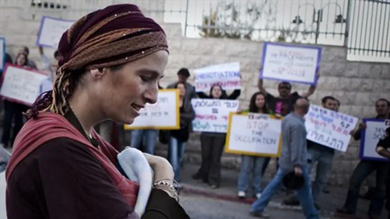 Jewish woman walks past left-wing demonstrato