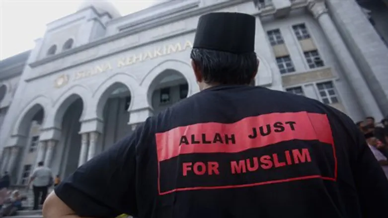 Muslim activist stands outside Malaysia court