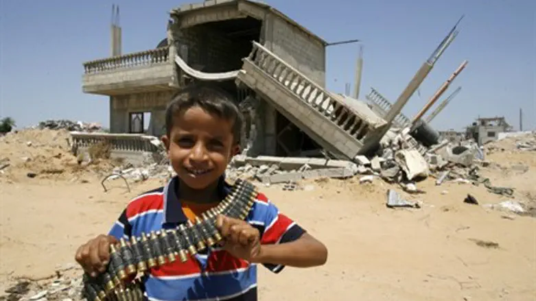 Arab child holds bullets in Gaza