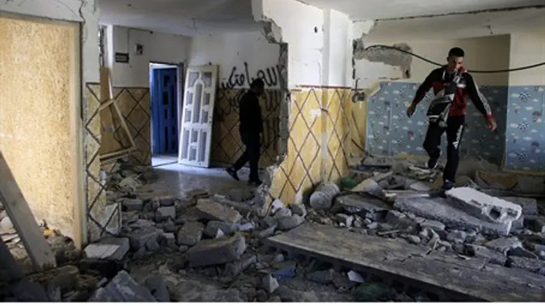 Family of terrorist Abdulrahman Shaloudi pick through partially destroyed home